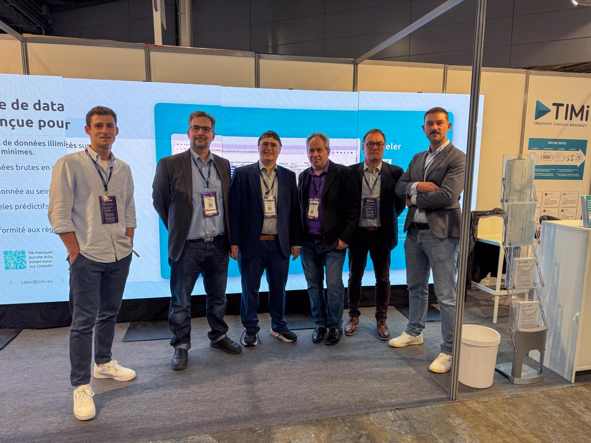 The TIMi team at a conference